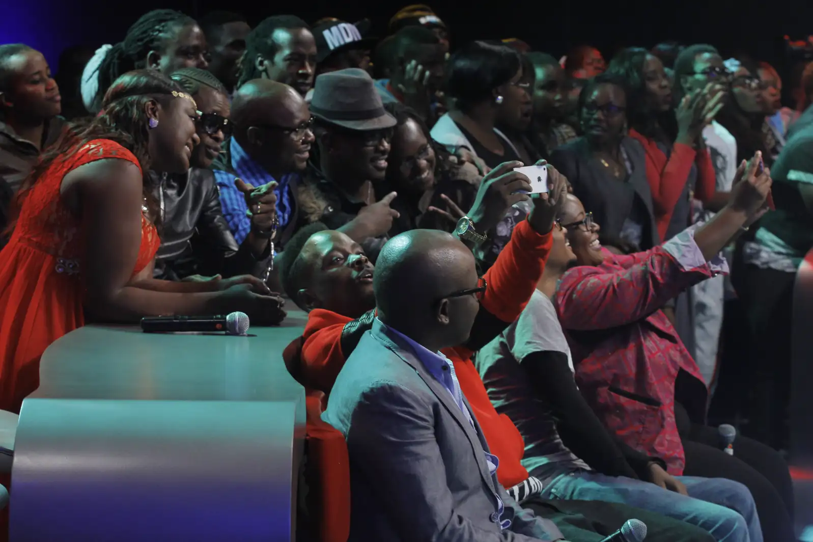 Group of women laughing and dancing at an outdoor festival